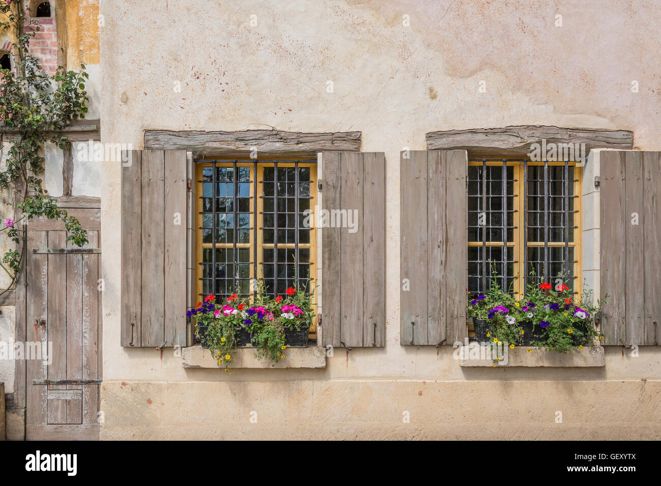 Windows of a medieval house in Marie Antoinette's estate at Versailles. Stock Photo