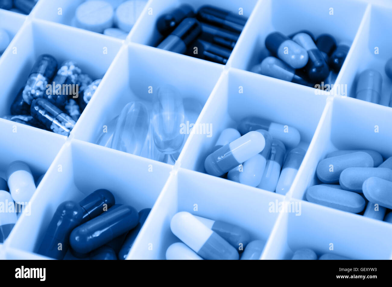 Large pill box for individual weekly pill storage. Pill Box for polypharmacy patients. Stock Photo