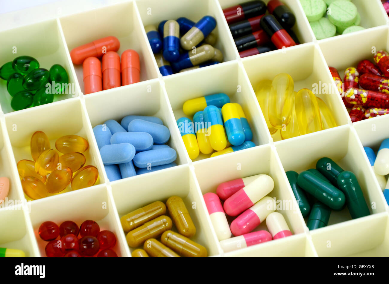Large pill box for individual weekly pill storage. Pill Box for polypharmacy patients. Stock Photo