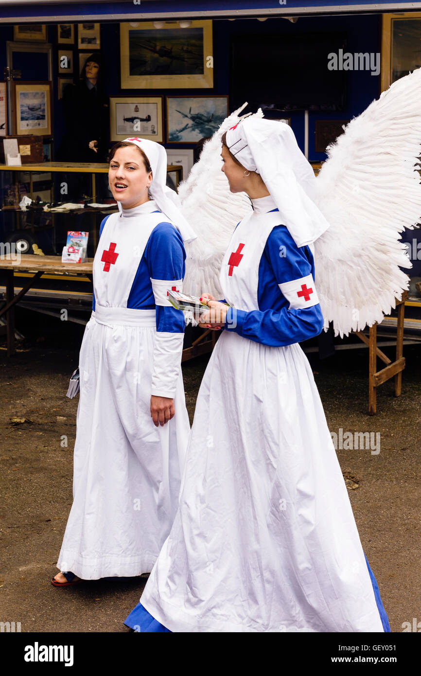 Two women dressed in nurses uniforms with angel wings at The War And Peace Revival event in Hyte. Stock Photo