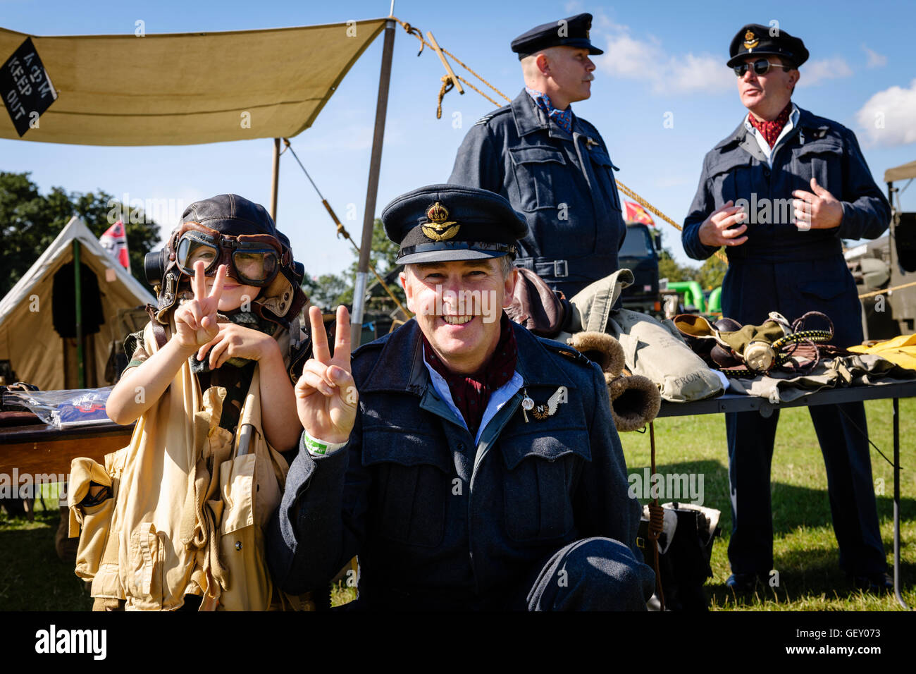 Men in RAF uniforms posing for photos to collect for charity at The 6th Annual Combined Ops Show. Stock Photo