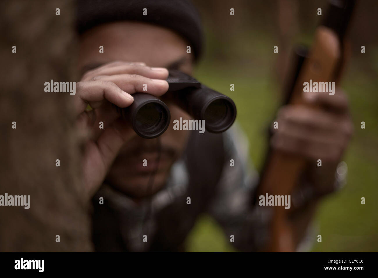 Interracial hunter in the forest Stock Photo