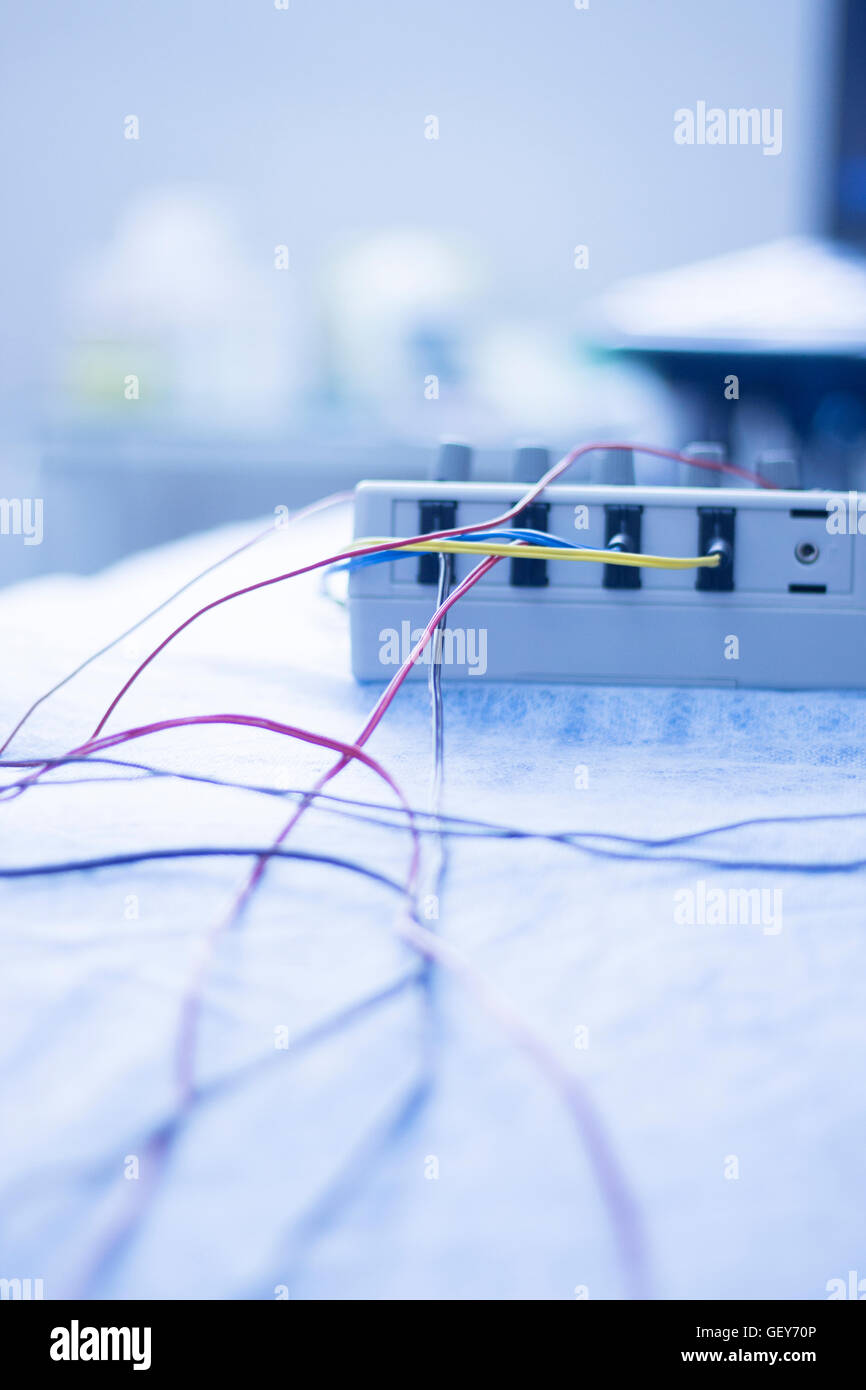 Dry needling electroacupunture cables connecting machine to needles used by acupunturist on