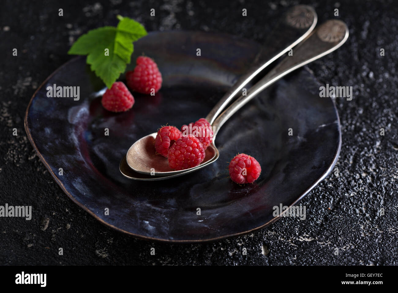 Fresh raspberry in a vintage spoon Stock Photo - Alamy