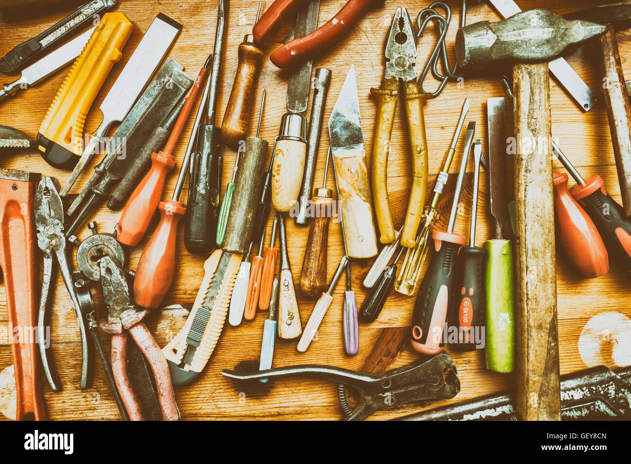 Different tools on a wooden background with retro filter effect Stock ...