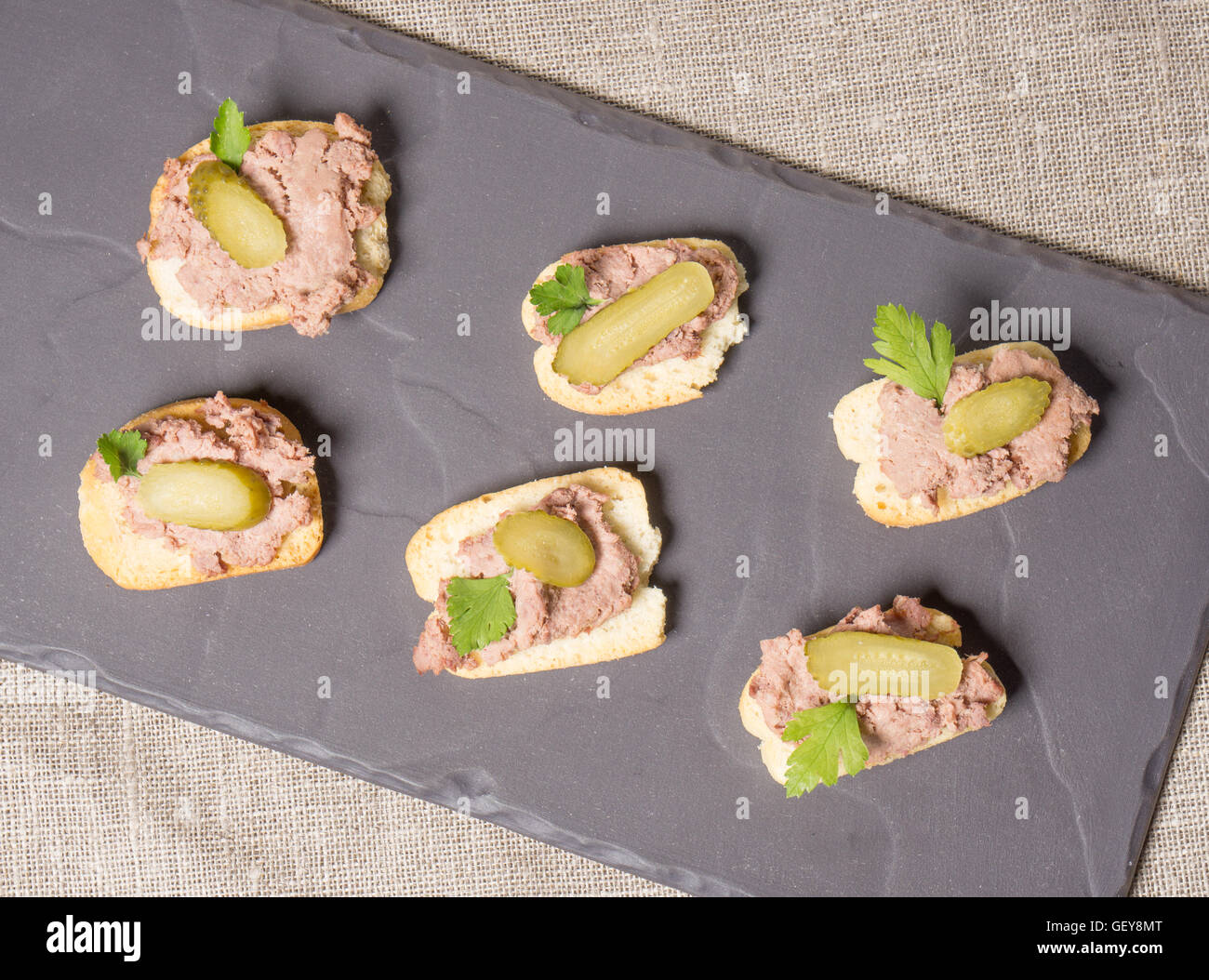 Canapes with Pate and Pickles served on a slate plate Stock Photo Alamy