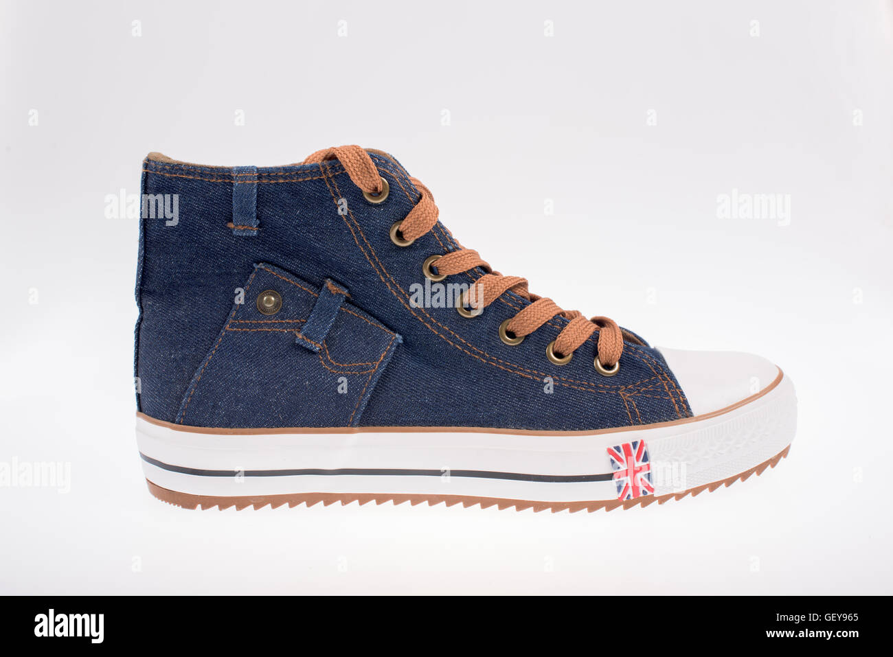 Right sneaker made of denim on a white background Stock Photo