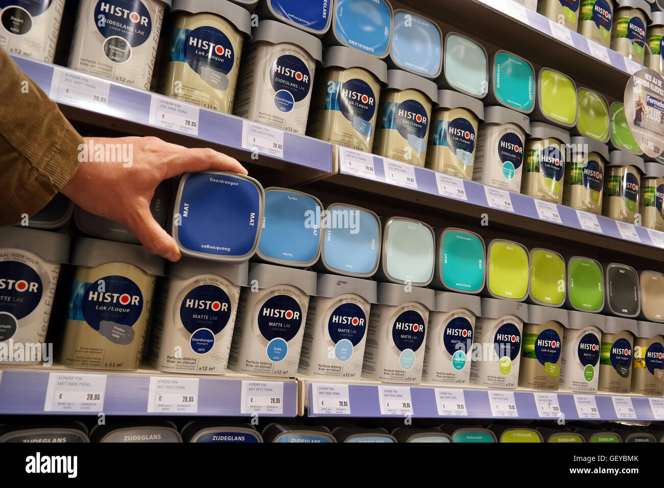 Range of paint cans in the paint department of a Hardware store. Stock Photo
