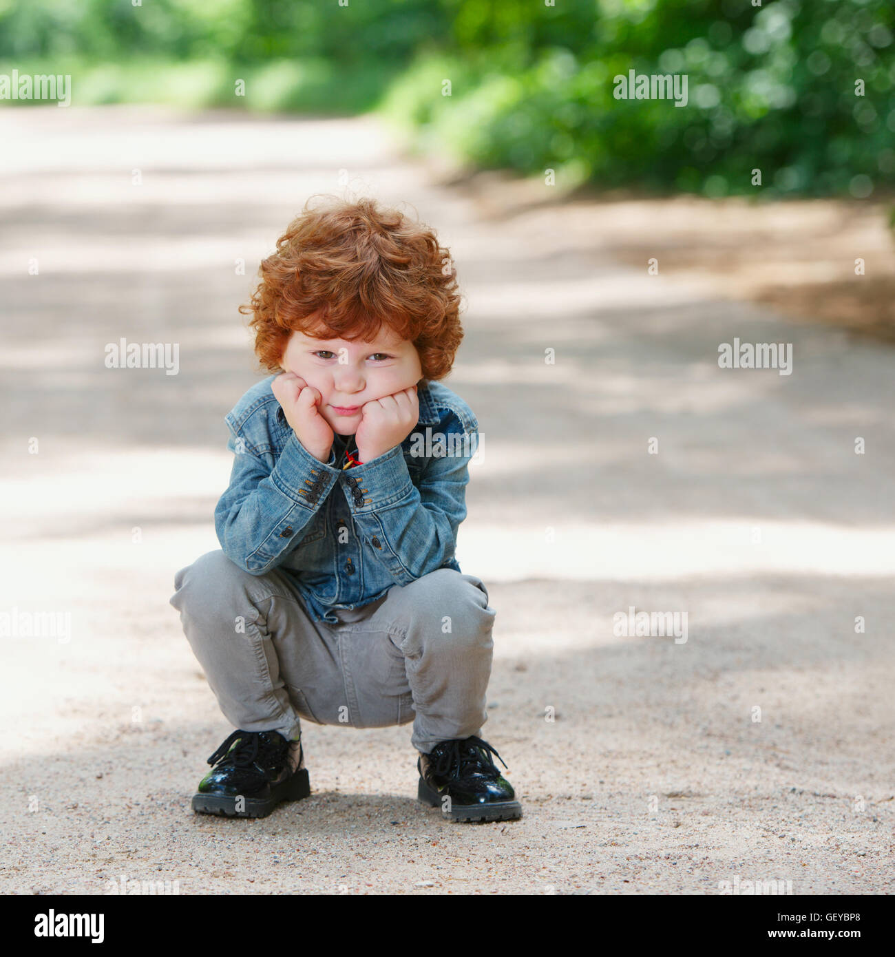 cute little emotional boy outdoors Stock Photo
