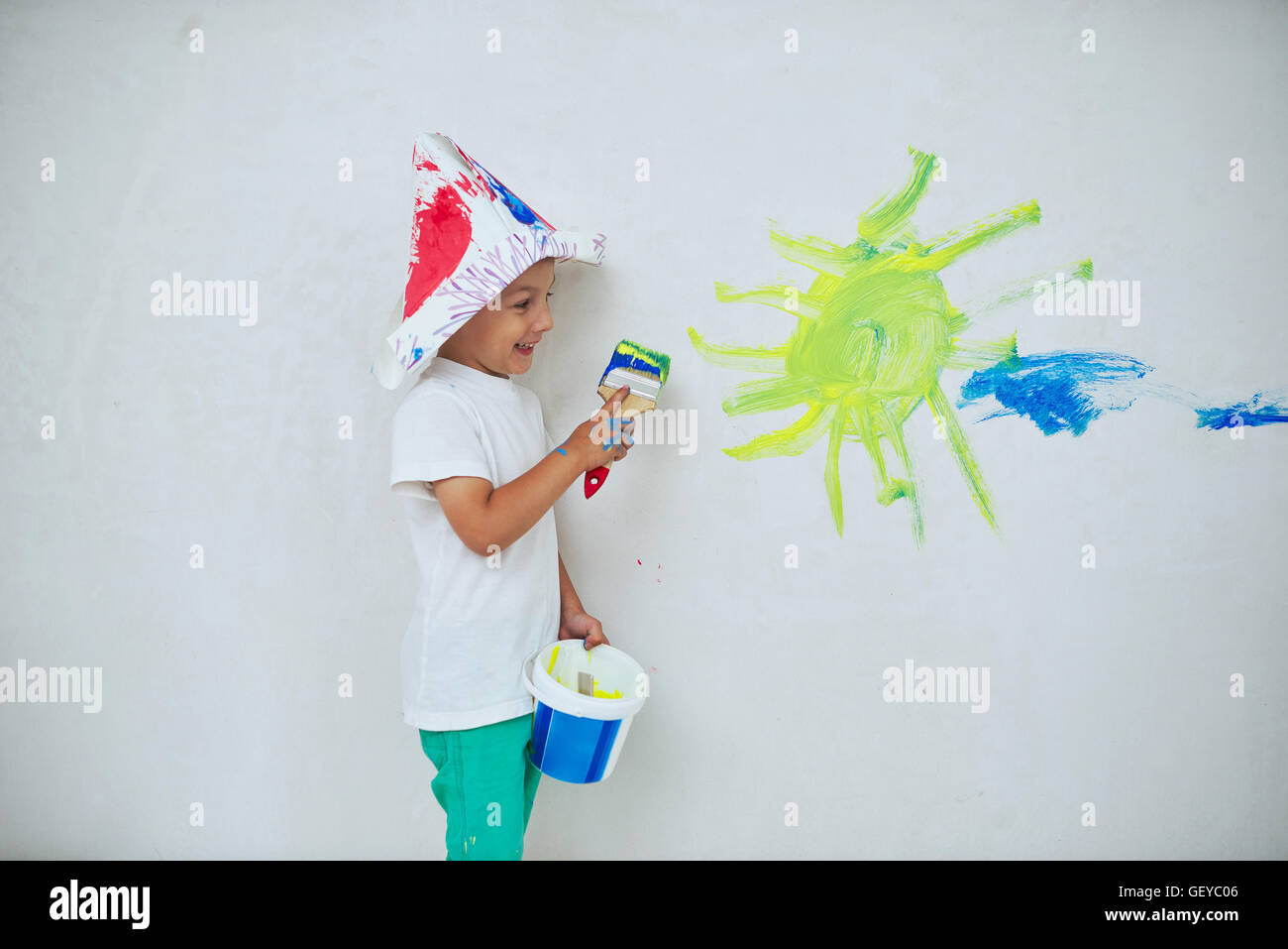 little happy boy with colorful brush Stock Photo - Alamy