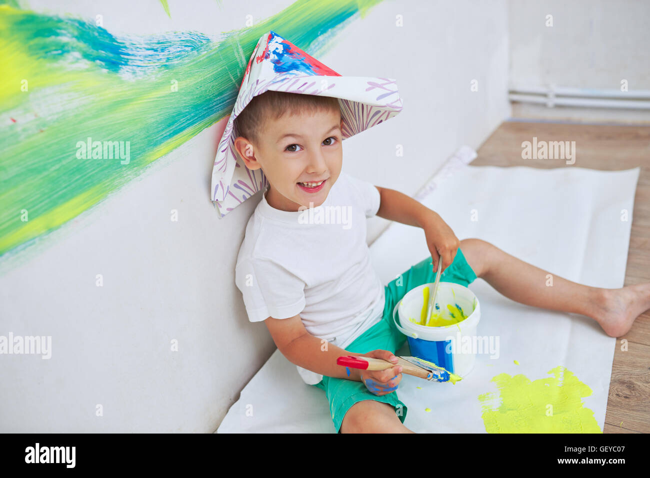 little happy boy with colorful brush Stock Photo - Alamy