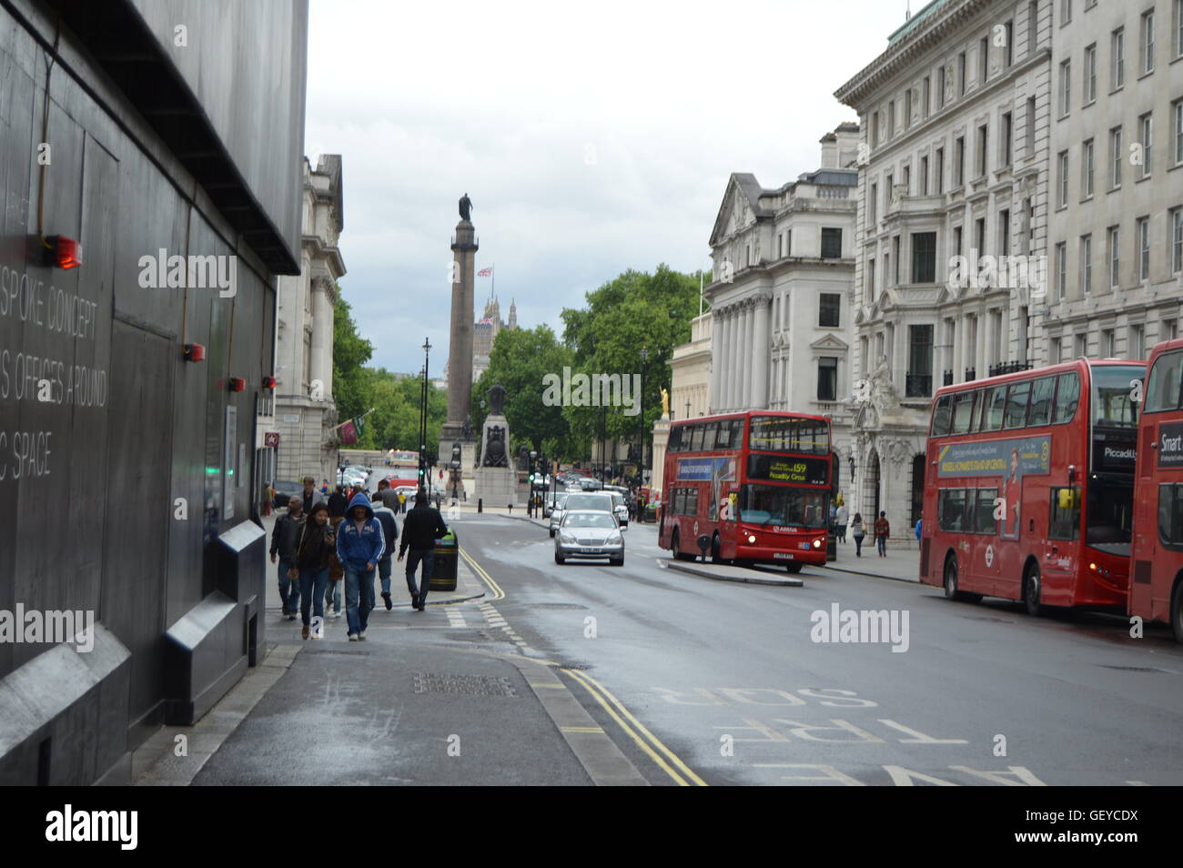 London Street view with the characteristic London double decker red buses. Stock Photo