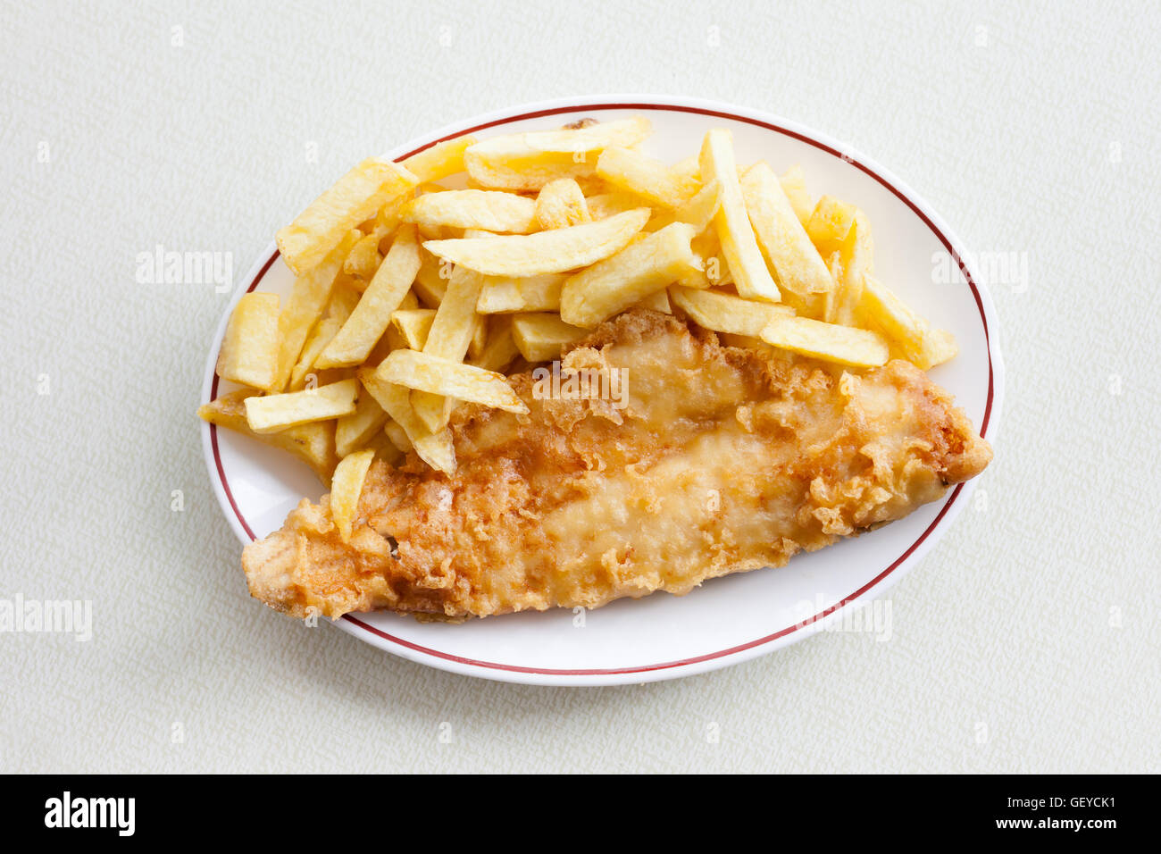 Traditional english meal deep fried fish, haddock with chips served
