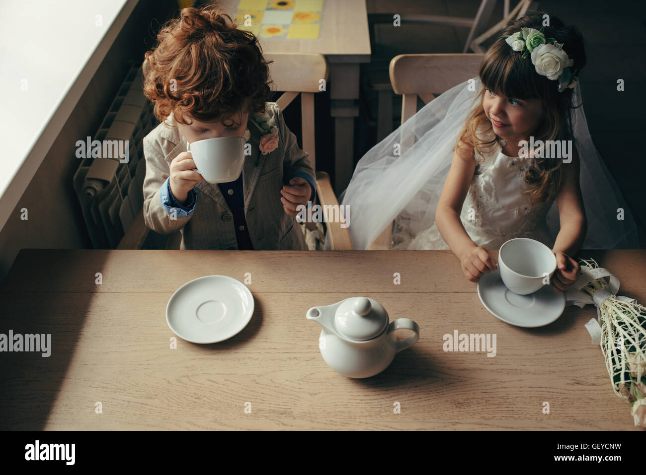 boy and girl having tea party in cafe Stock Photo - Alamy
