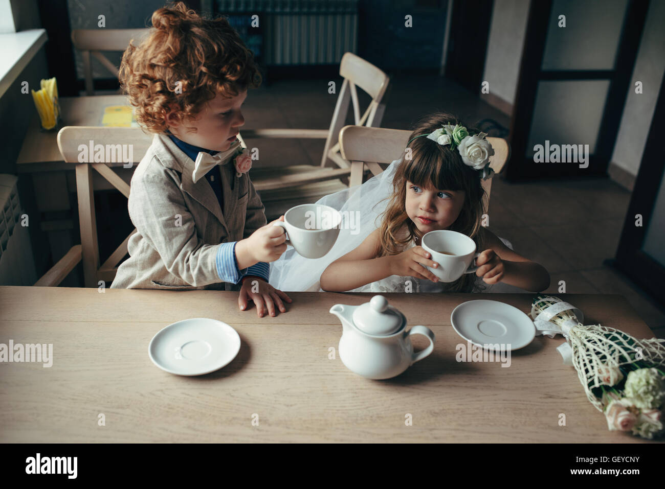 Boy girl playing tea party hi-res stock photography and images - Alamy