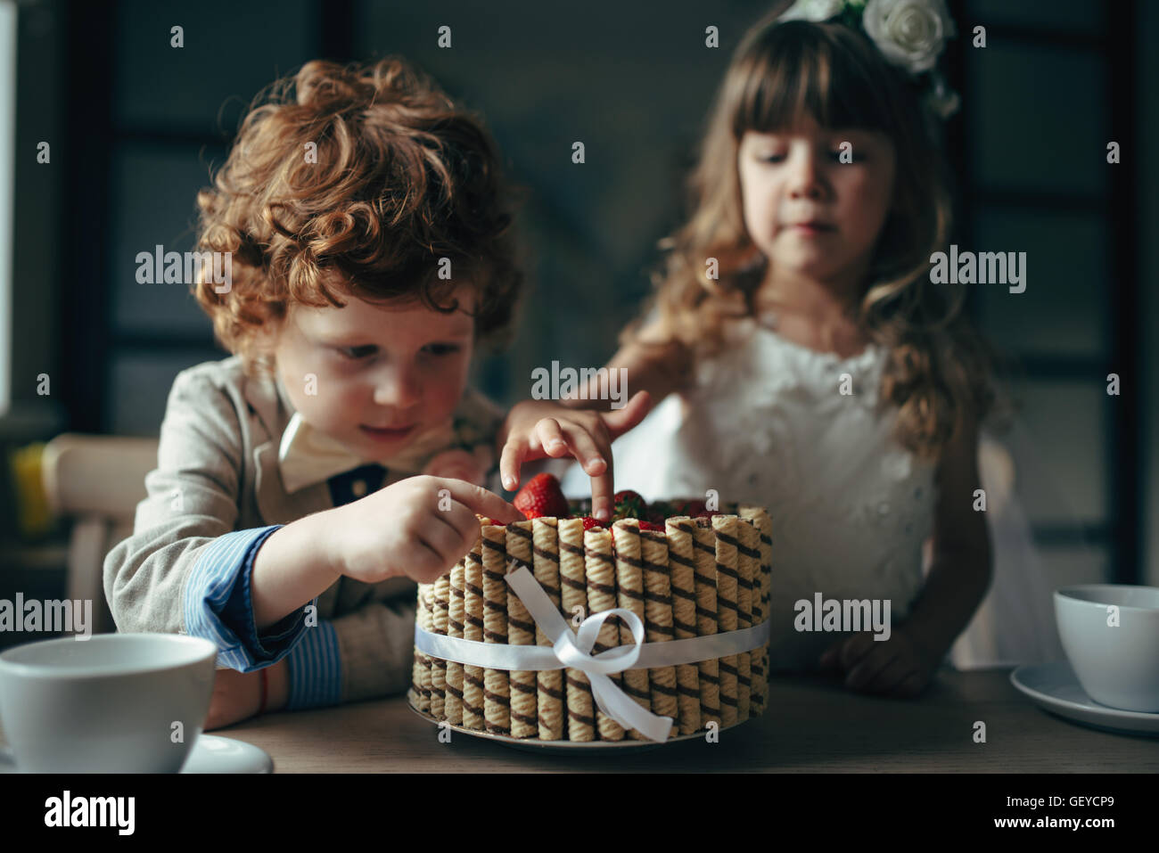 Boy girl playing tea party hi-res stock photography and images - Alamy