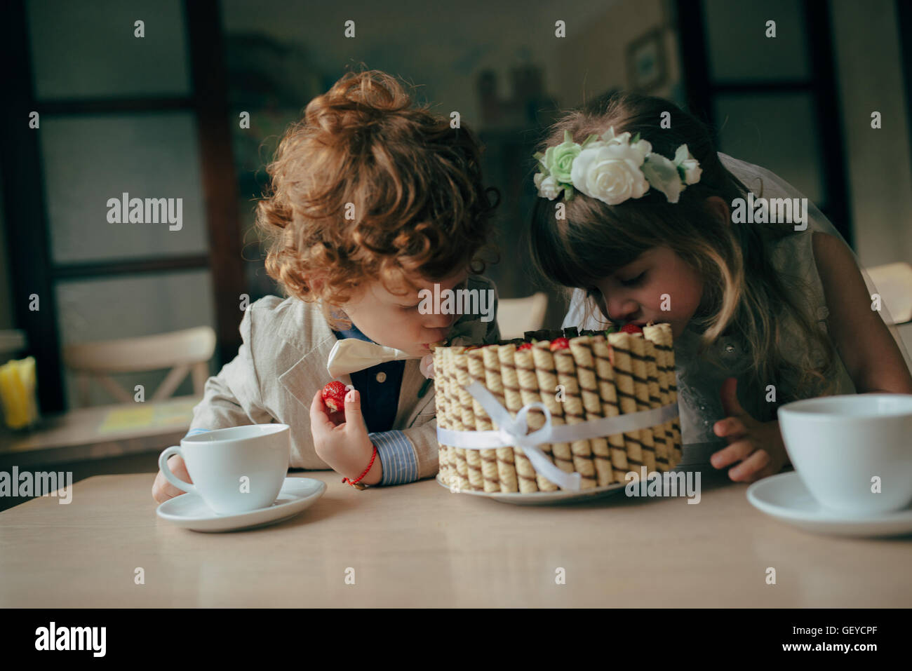 Boy girl playing tea party hi-res stock photography and images - Alamy