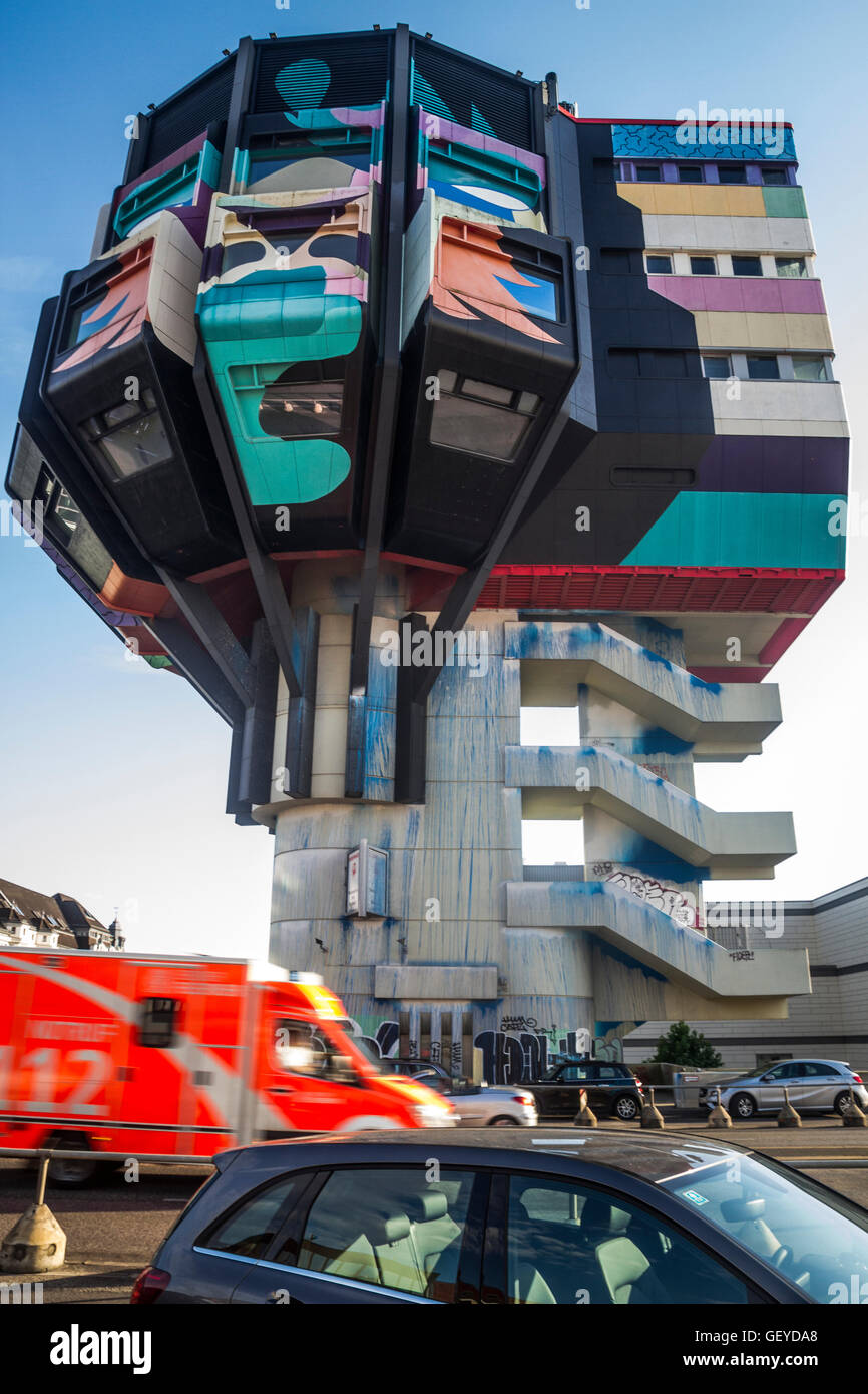 Traffic passes the base of the Bierpinsel in Steglitz, Berlin, Germany. Stock Photo