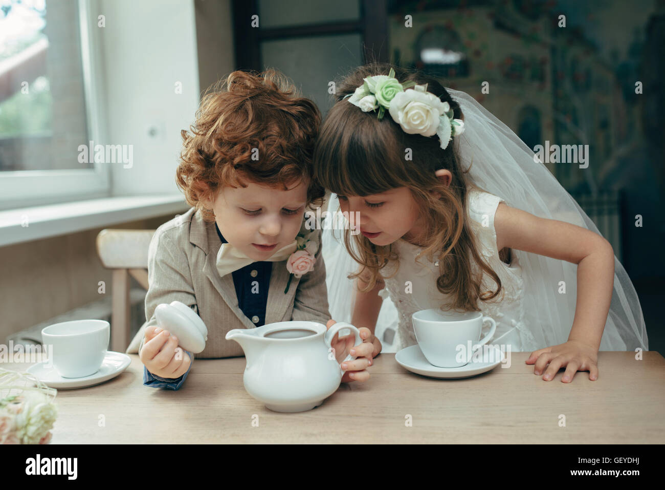Boy girl playing tea party hi-res stock photography and images - Alamy