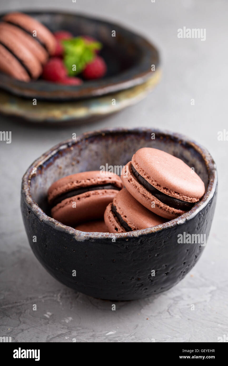 Chocolate french macarons with ganache filling Stock Photo Alamy