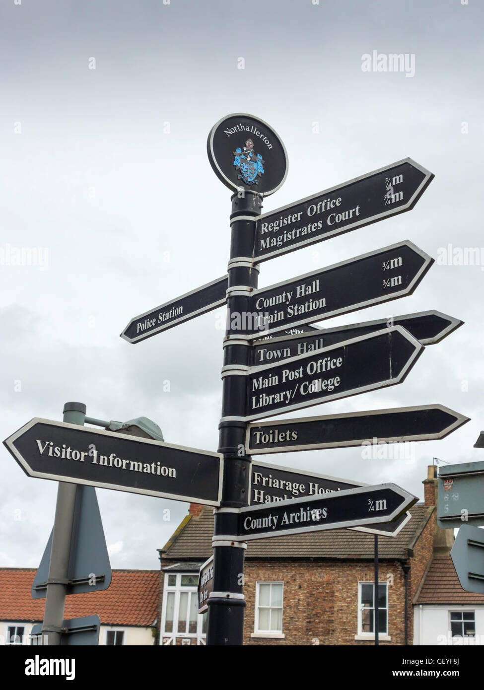 A signpost in Northallerton North Yorkshire  showing directions to various attractions Stock Photo
