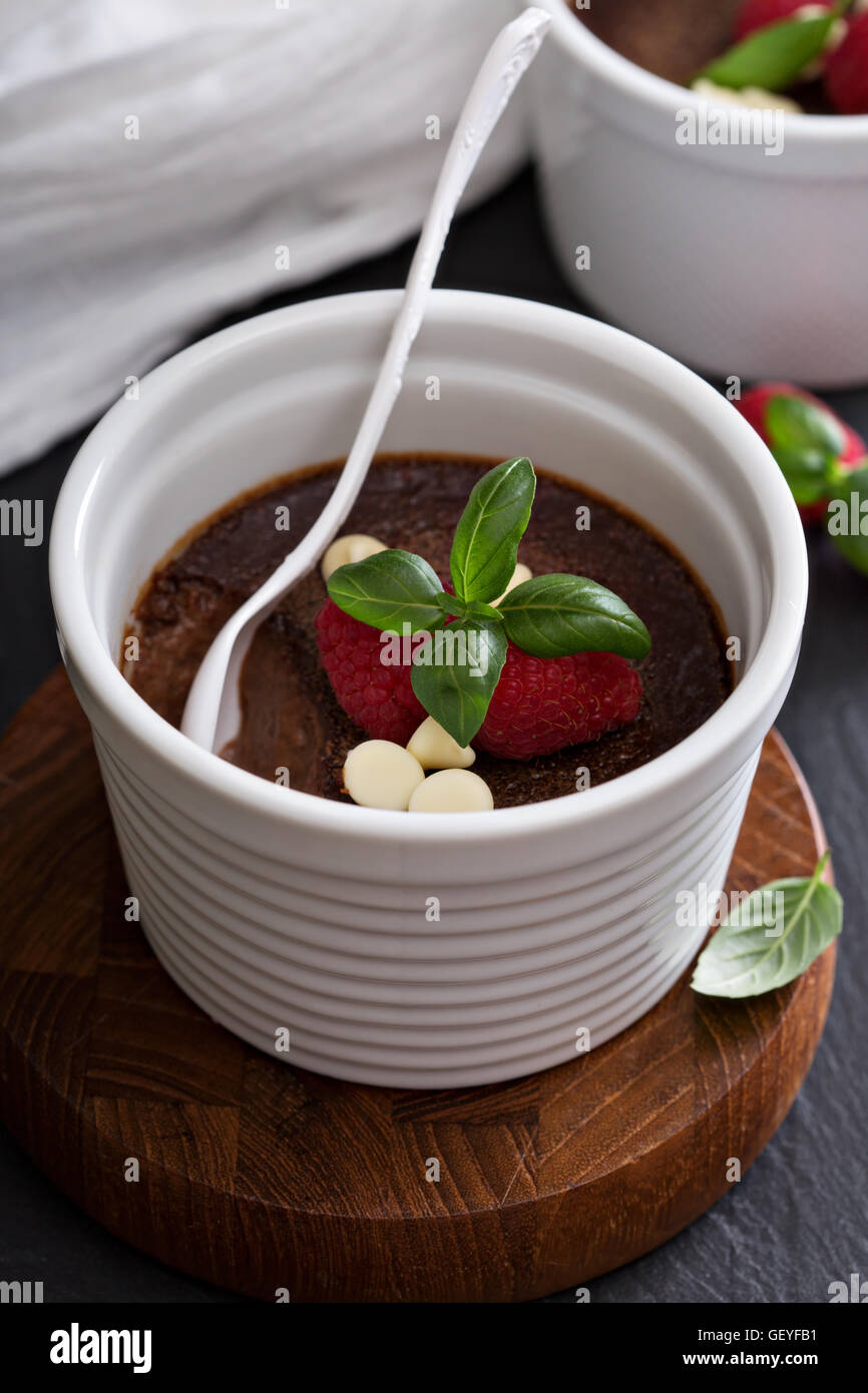 Chocolate pudding with raspberries and basil Stock Photo Alamy