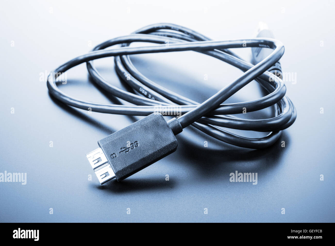 isolated usb 3.0 cable in cyan tone Stock Photo