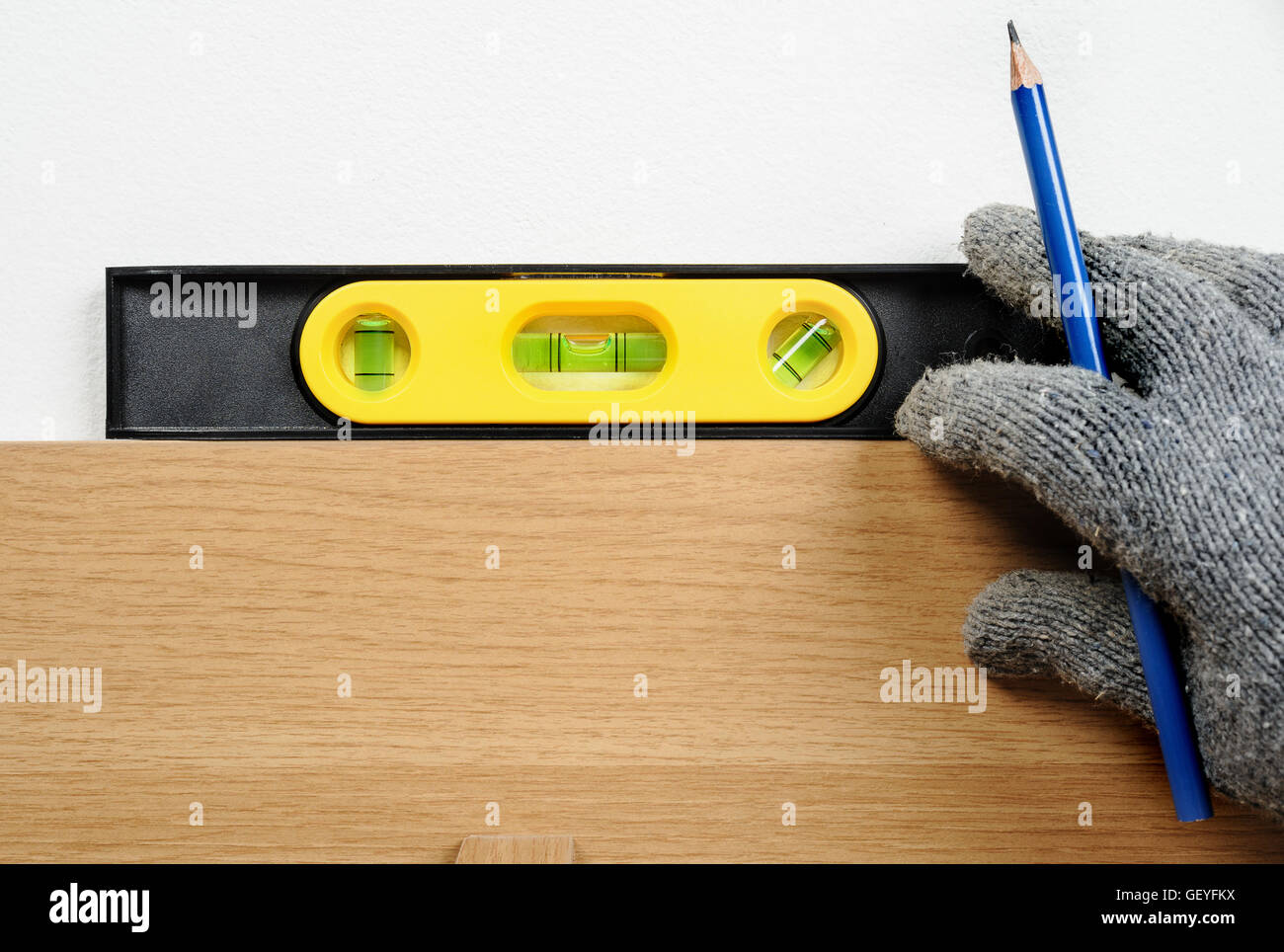 technician using spirit level to checking the level Stock Photo