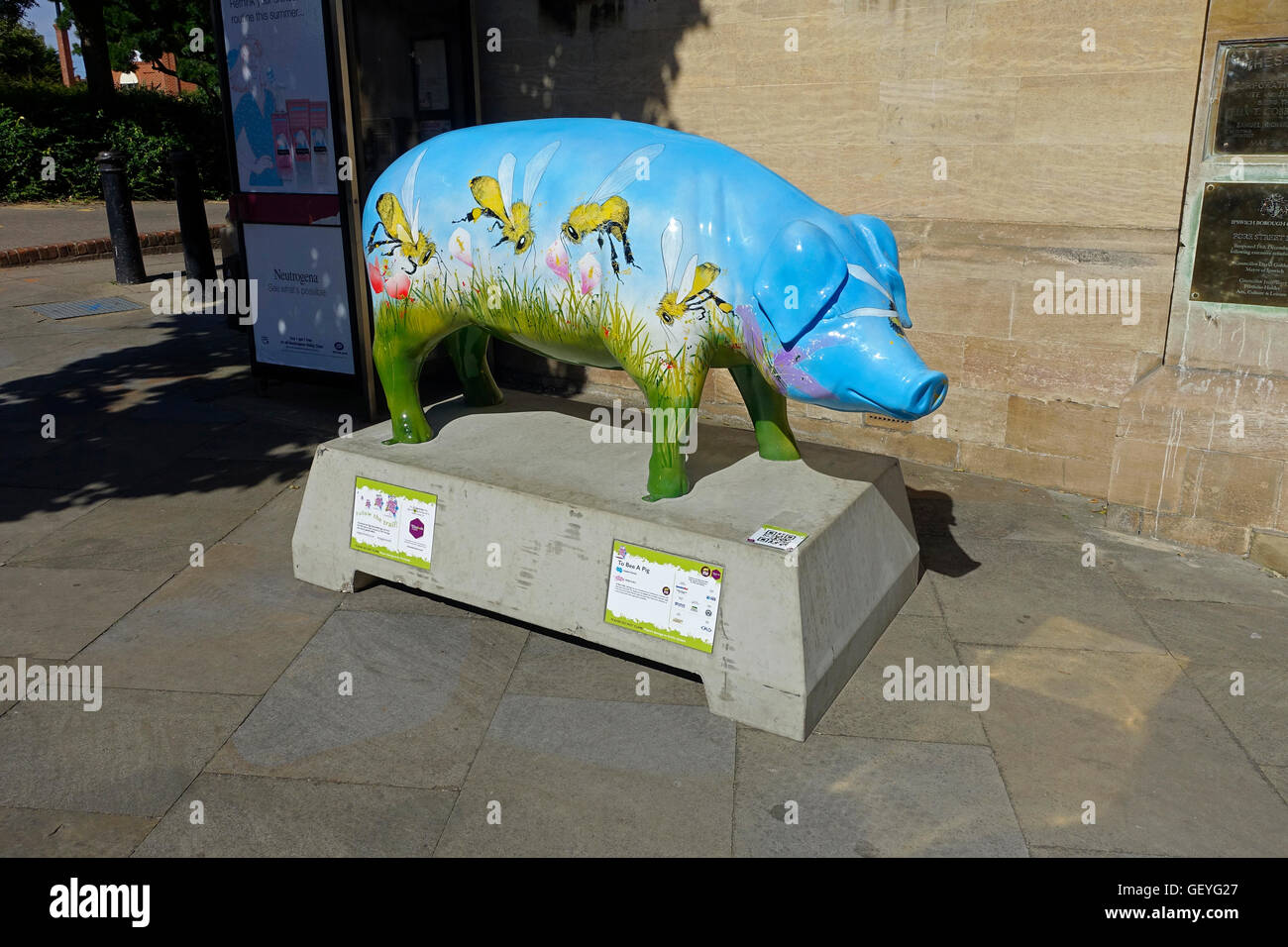 ‘To Bee a Pig’ pig sculpture, part of ‘Pigs Gone Wild’ interactive art trail on the streets of Ipswich, Suffolk summer, 2016 Stock Photo