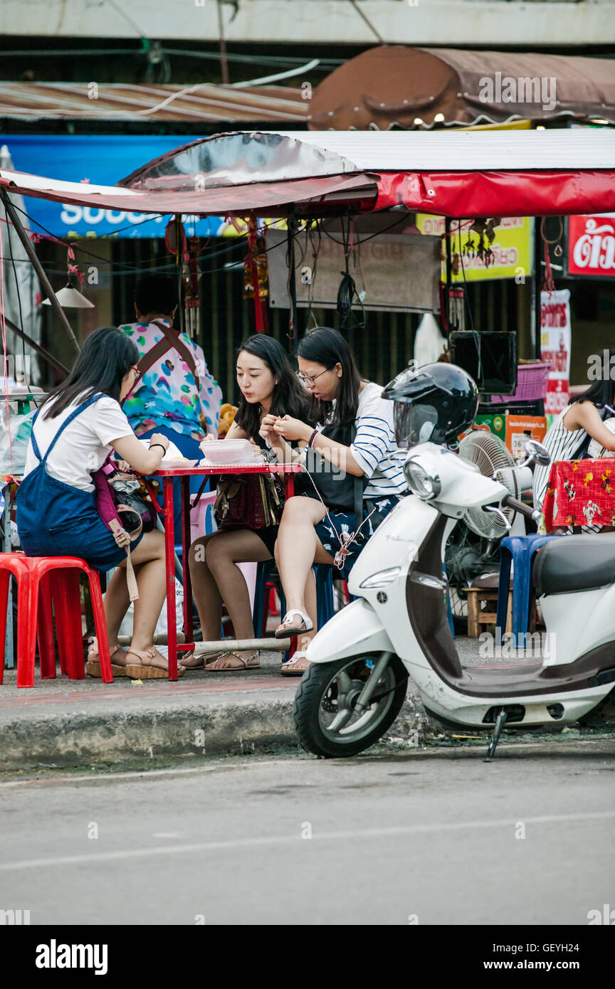 People eating in Food market by Chang Phuak Gate,north gate Chiang Mai Thailand Stock Photo