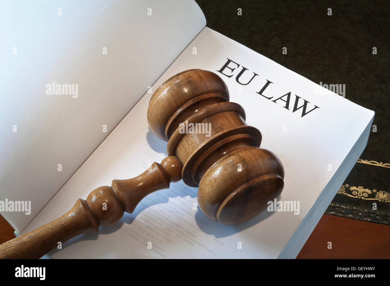 Concept image of open EU Law book on desk with judges gavel Stock Photo
