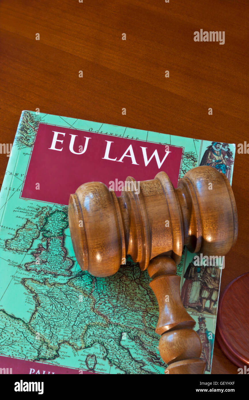 BREXIT Concept image of EU Law book with map of UK & Europe front cover, on desk with judges gavel Stock Photo