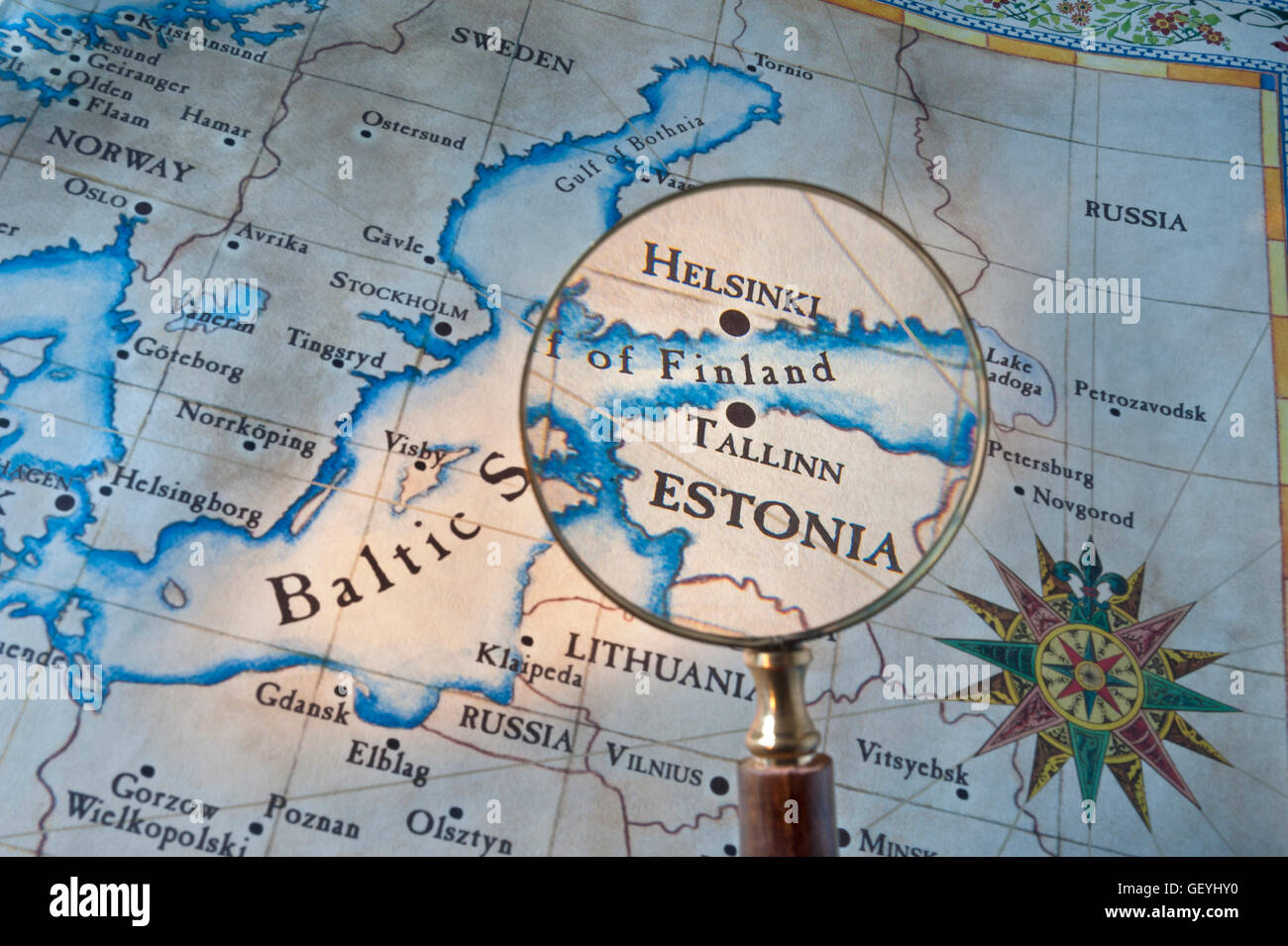 HELSINKI Old style map with magnifying glass over Gulf of Finland featuring Helsinki & Tallinn with Baltic Sea Sweden & Eastern Europe Stock Photo