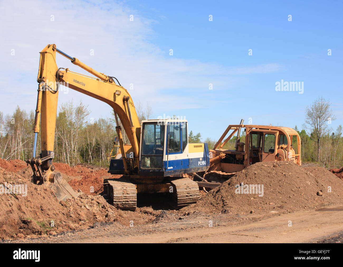 KENNETCOOK, CANADA - MAY 29, 2016: Komatsu excavator and Dresser bulldozer at rural construction site. Stock Photo
