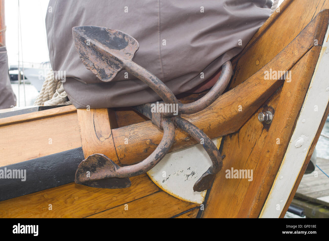 4 fluked anchor on wooden boat Stock Photo