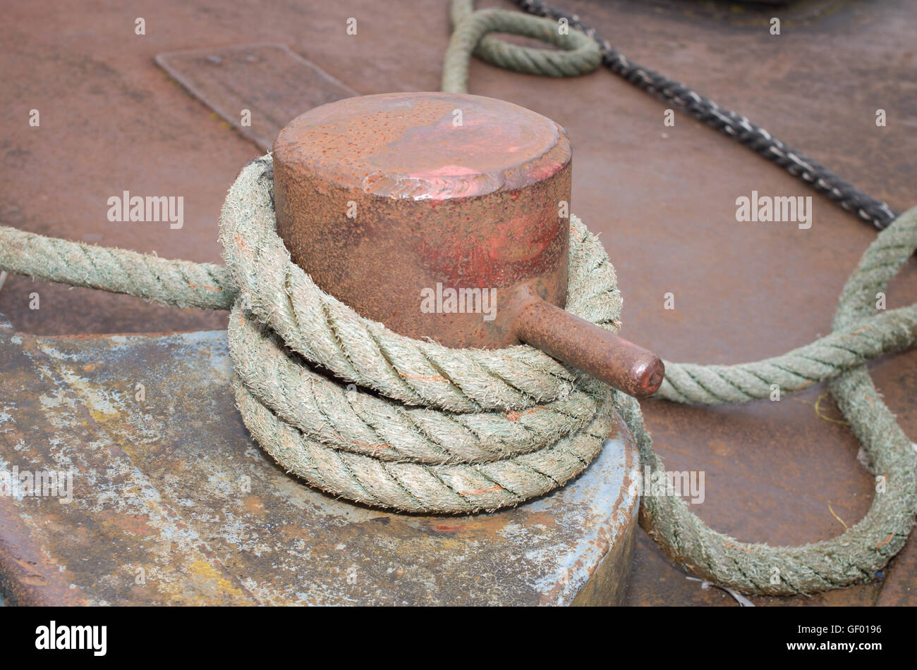 Samson post with old rope Stock Photo
