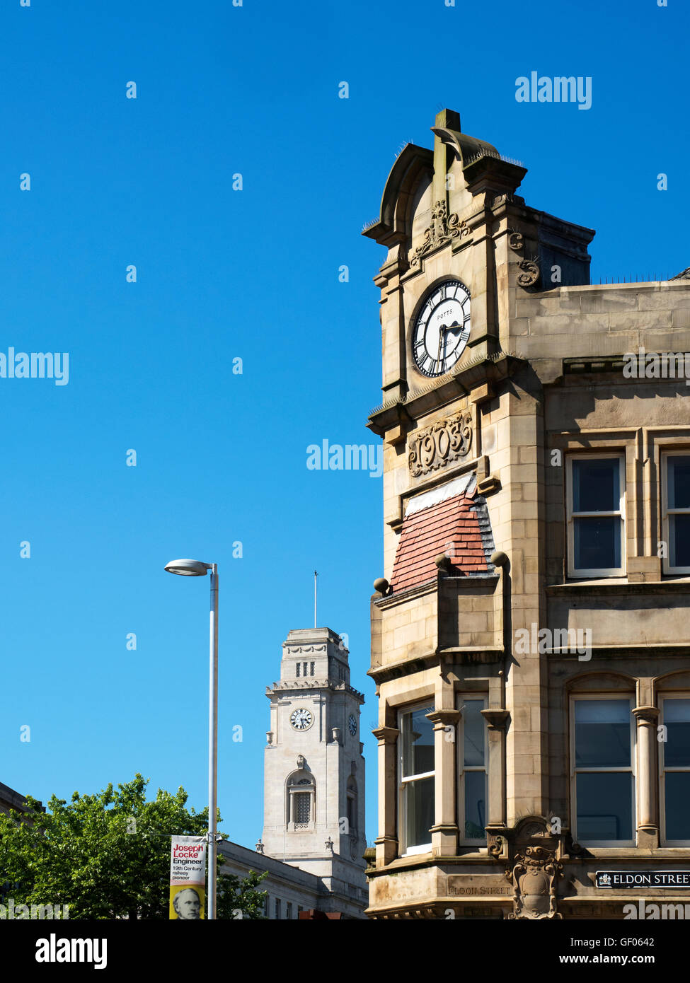 Clock on the Old Yorkshire Penny Bank Building with Town Hall behind