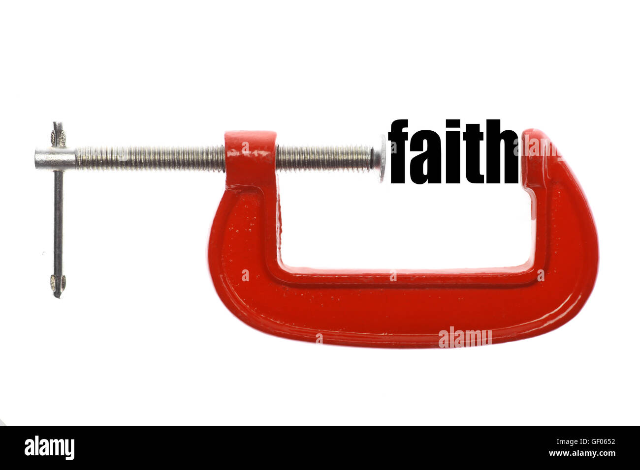 The word "faith" is compressed with a vice. Stock Photo