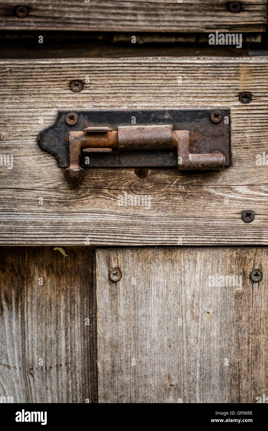 Lock Rusted Dark Shed Old rusted lock on a shed in the garden Stock Photo - Alamy