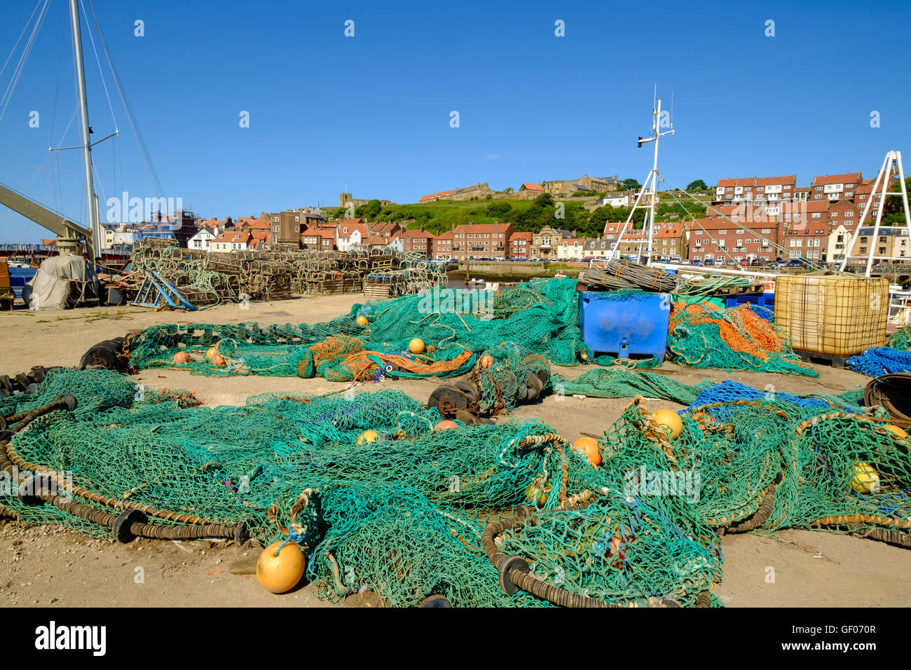 Fishing nets laid out on Whitby Harbour, North Yorkshire, UK on a summer afternoon Stock Photo