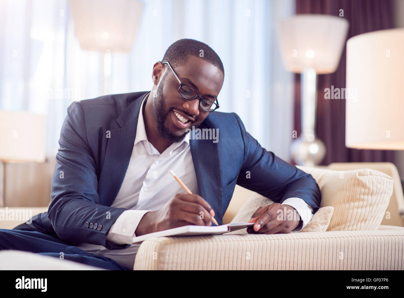 Afro American man taking notes Stock Photo