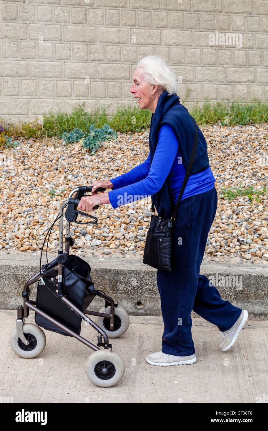 An Elderly Woman Walking With A Rollator Walking Aid, Rottingdean
