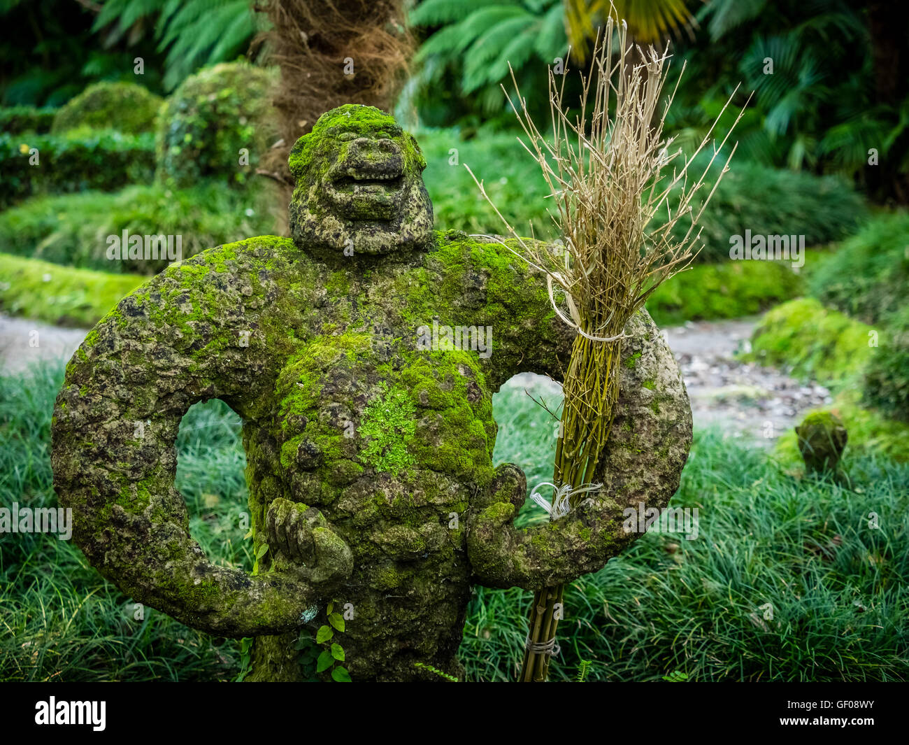 Proud monkey moss covered sculpture in The Terra Nostra Garden in