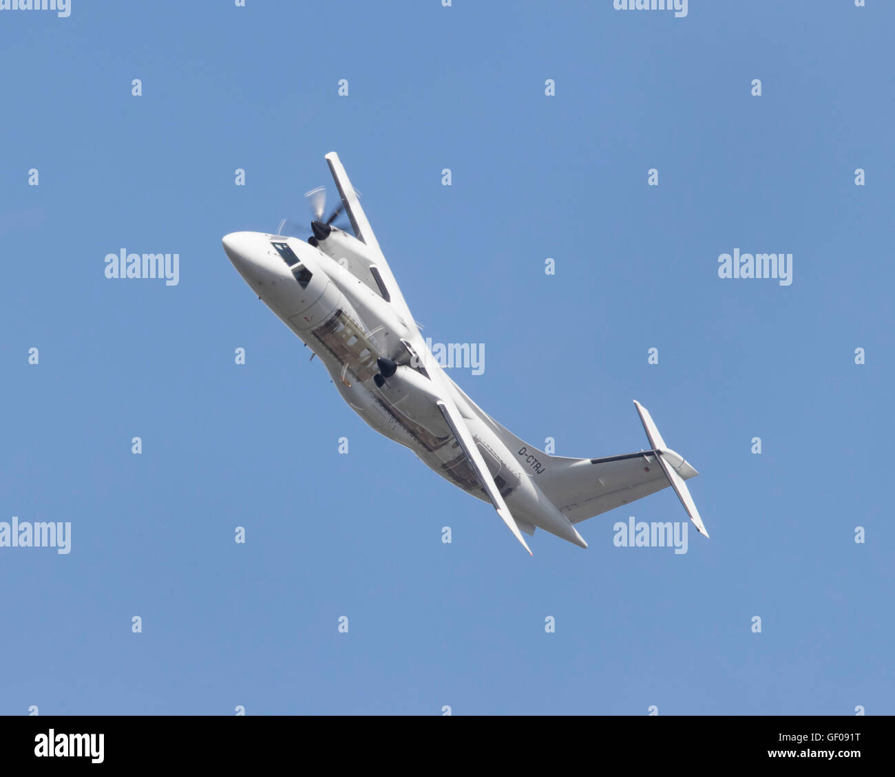 Dornier 328 twin turbo-prop aircraft registration D-CTRJ flying at the 2016 Farnborough International Air Show Stock Photo