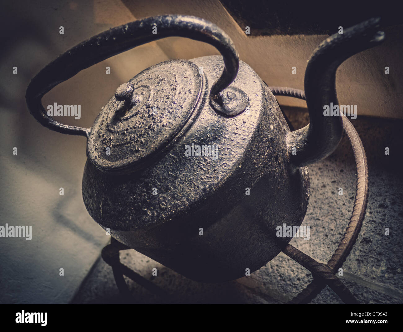 Old black kettle in a traditional tearoom in an old tea factory Stock