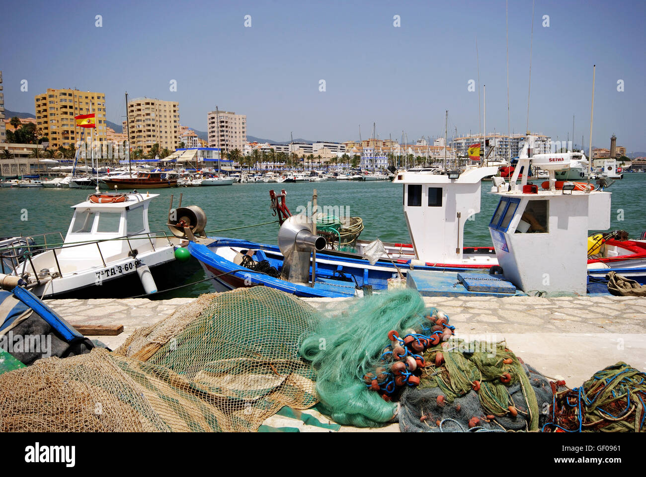 Fishing nets and blue fishing boats in Essaouira Port