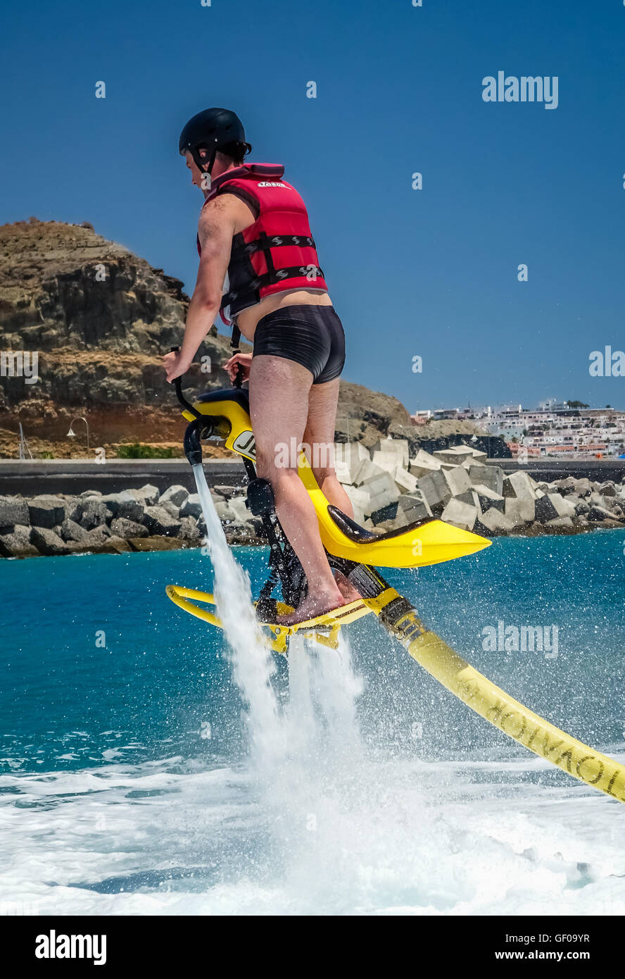 Man Trying To Get Hovering Above Water On A Jet Ski In Gran Canaria 