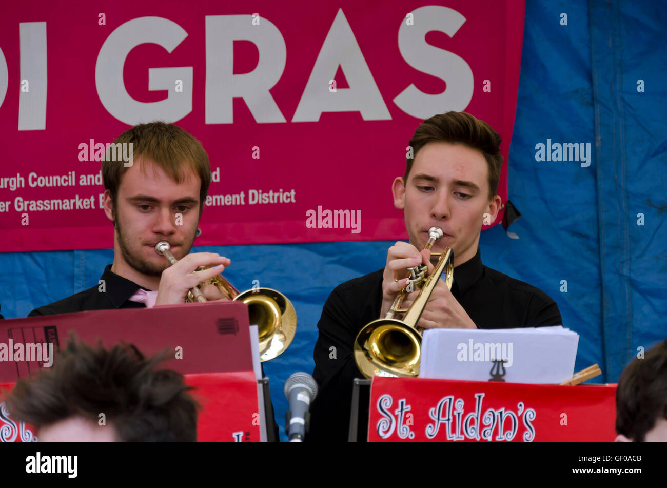 Two trumpet players with the St. Aiden's Swing Band (school band) playing at the Mardi Gras, part of the Edinburgh Jazz Festival Stock Photo