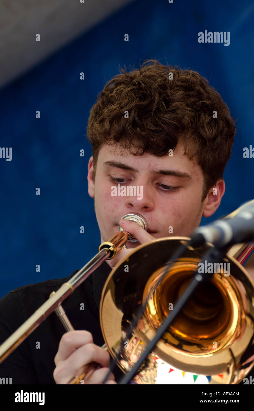 Trombone player with the St. Aiden's Swing Band (school band) playing