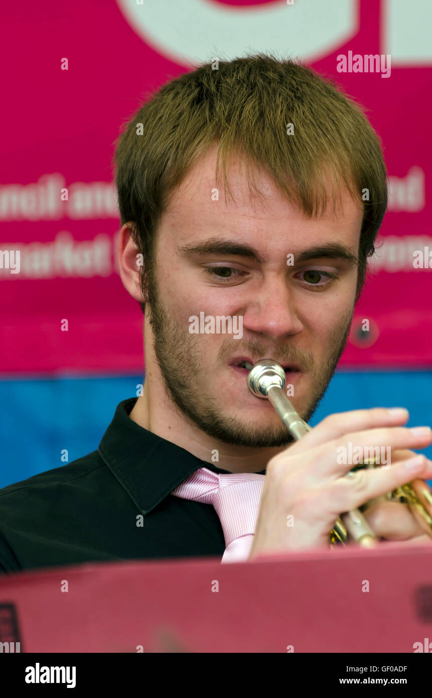 Trumpet player with the St. Aiden's Swing Band (school band) playing at the Mardi Gras, part of the Edinburgh Jazz Festival. Stock Photo